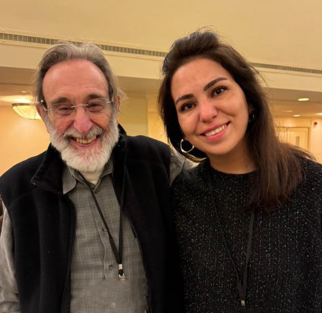 Professional man and woman smile