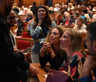 Engaged professionals listen intently